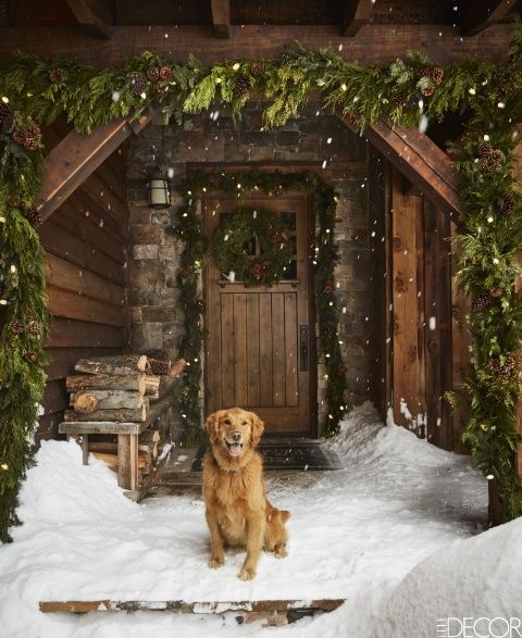 A Montana cabin's entrance decorated for Christmas by Ken Fulk, Photographed by Douglas Friedman